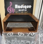 Back of the WC-1 size wood cabinet, open rear with the underside of the perforated top visible and two dark corner brackets on the base