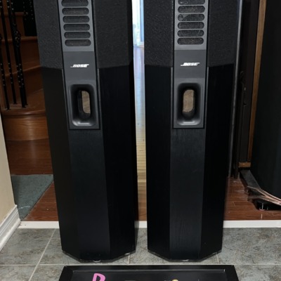 Pair of Bose 701 Series I tower speakers in black ash, front view showing the slotted grille strip, Bose badge and front port