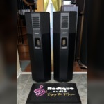 Pair of Bose 701 Series I tower speakers in black ash, front view showing the slotted grille strip, Bose badge and front port