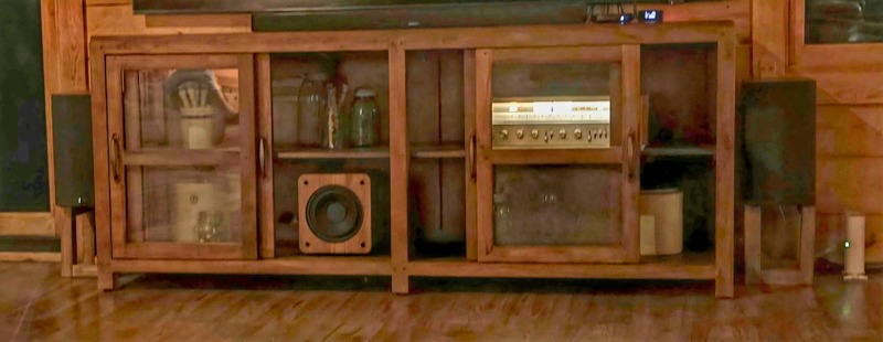 David E.’s Pioneer SX-750 receiver in a rustic wood media cabinet, with Polk Audio speakers and a subwoofer, in Sullivan, Illinois