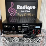 Rear panel of the Denon DRA-835R receiver with audio inputs, speaker terminals, model label and power cord