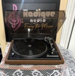 Dual 504 with the dust cover raised, showing the ribbed rubber mat, strobe-dotted platter rim, tonearm and Dual 504 Belt Drive badge