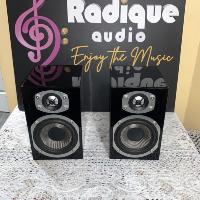 Energy RC-Mini bookshelf speakers in high gloss piano black, front view with the grilles off, showing the Kevlar woofers and aluminum dome tweeters
