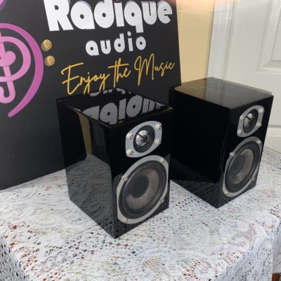 Energy RC-Mini speakers in high gloss black, angled view of the mirror-like piano black cabinets
