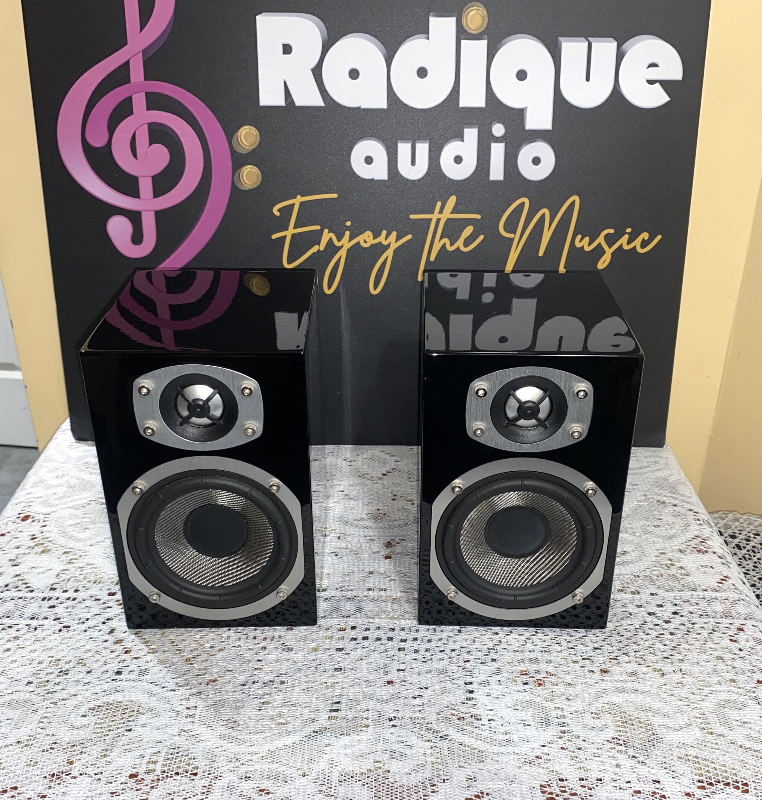 Energy RC Mini Bookshelf Speakers High Gloss Black Front Energy RC-Mini bookshelf speakers in high gloss piano black, front view with the grilles off, showing the Kevlar woofers and aluminum dome tweeters