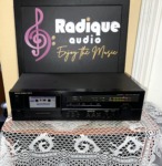 Harman Kardon TD212 cassette deck straight on, black faceplate with cassette well, tape counter, Dolby B/C switch and level display