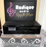 Harman Kardon TD212 cassette deck straight on, black faceplate with cassette well, tape counter, Dolby B/C switch and level display