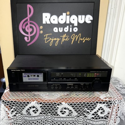 Harman Kardon TD212 cassette deck straight on, black faceplate with cassette well, tape counter, Dolby B/C switch and level display