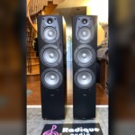Infinity Beta 40 tower speakers — front view with grilles off, four drivers visible