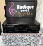 JVC TD-W254BK double cassette deck, black front panel with two auto-reverse tape wells, a dark display window and a centre knob