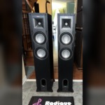 Klipsch KF-26 Icon towers — front view with grilles off, Tractrix horn and dual woofers visible
