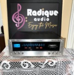 Marantz 112 stereo tuner, brushed silver faceplate with blue-lit FM/AM dial, tuning meter, Gyro-Touch tuning wheel and red indicator lamps