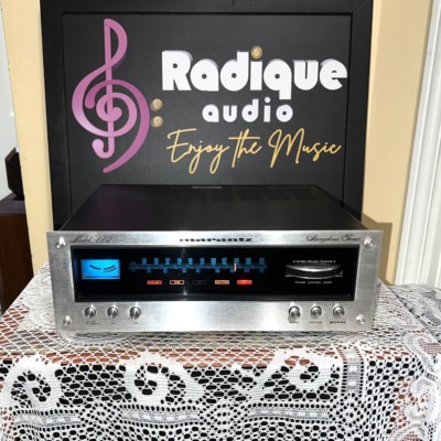 Marantz 112 stereo tuner, brushed silver faceplate with blue-lit FM/AM dial, tuning meter, Gyro-Touch tuning wheel and red indicator lamps