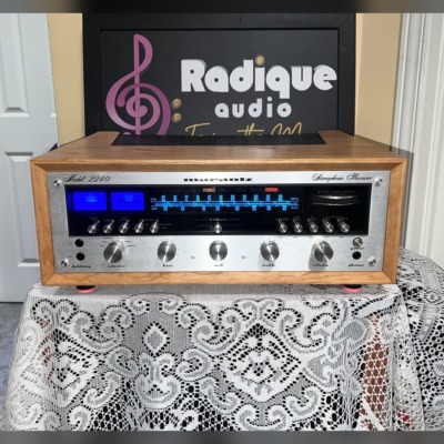 Marantz 2240 stereo receiver in WC-22 Style Ottawa Valley cherry cabinet — front view, silver faceplate and blue/red dial illumination.