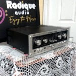 Marantz Model 1070 integrated amplifier, brushed silver faceplate with selector and tape monitor knobs, slider tone controls and black case
