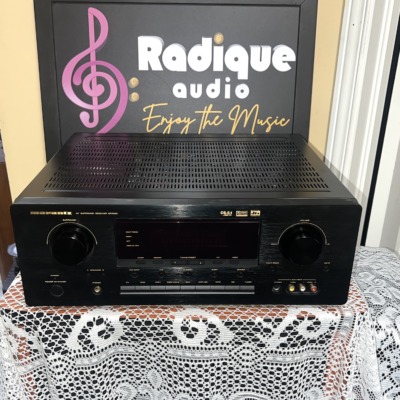 Marantz SR7200 AV surround receiver in black, front panel with surround and volume knobs either side of a central display and input buttons