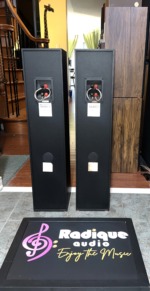 Rear of the Monitor Audio Bronze 3 towers with bi-wire binding posts joined by wire jumpers above the white Bronze 3 model labels