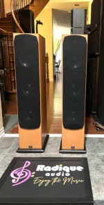 Monitor Audio Silver S8 floorstanders with their black curved grilles fitted over the full height of the front baffle