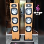 Monitor Audio Silver S8 floorstanding speakers in Warm Beech veneer, grilles off to show the gold dome tweeter and three silver C-CAM cones