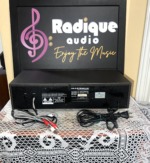 Rear panel of the NAD 6130 cassette deck with its input and output leads, NAD Electronics model label and power cord