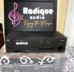 NAD 6130 stereo cassette deck in black, cassette window with tape loaded, tape counter, Dolby B/C lamps and transport keys