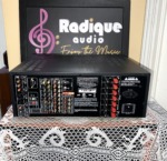 Rear panel of the NAD T 757 receiver showing its audio and video connections, speaker terminals and power inlet