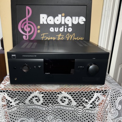 NAD T 757 AV surround sound receiver, front panel with display, volume knob and input buttons