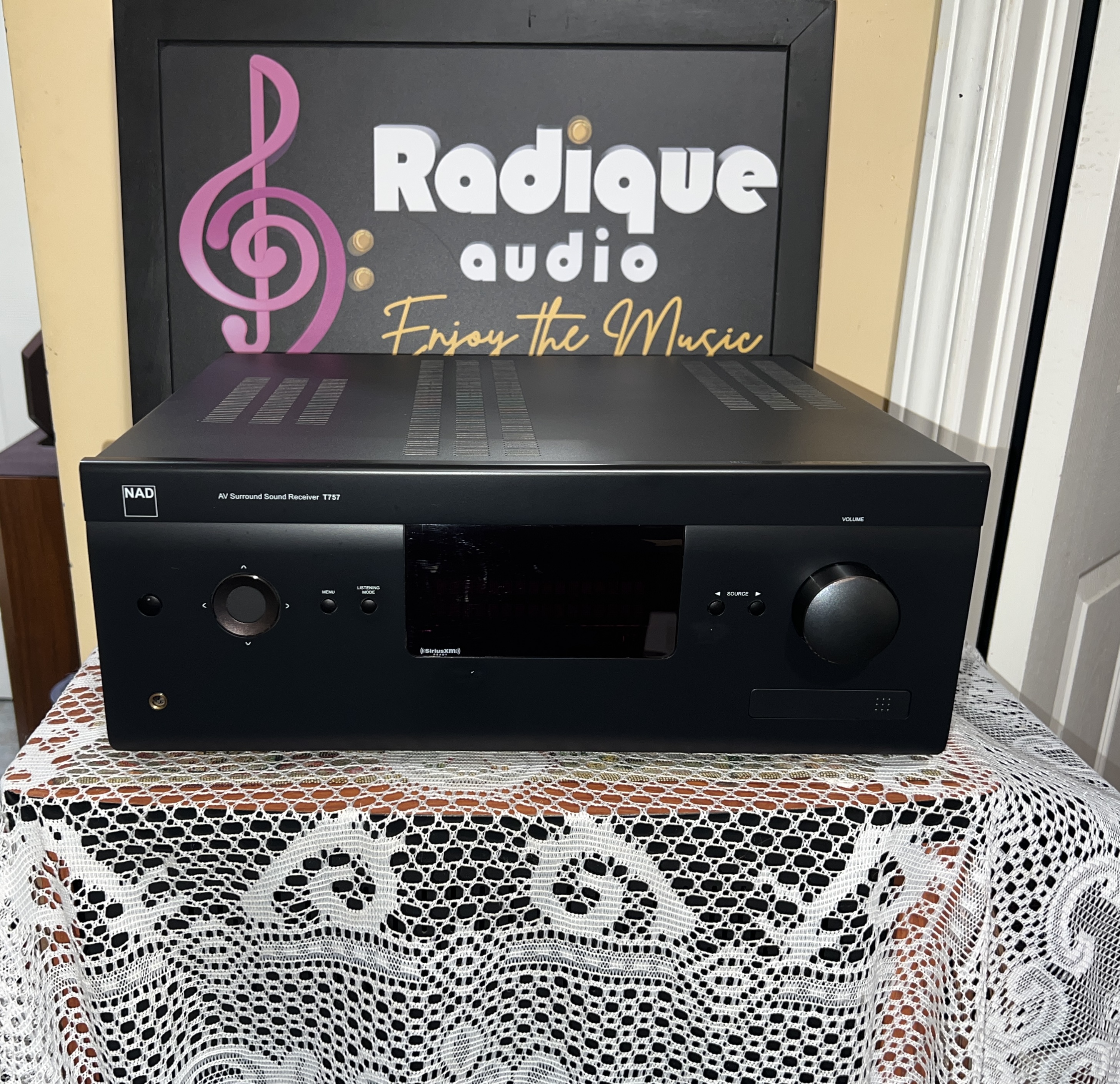 NAD-T-757-AV-Surround-Sound-Receiver-Front NAD T 757 AV surround sound receiver, front panel with display, volume knob and input buttons