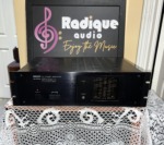 Nikko Alpha 230 stereo power amplifier in black, brushed faceplate with rack-mount ears, protect light and a column of output level LEDs