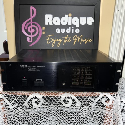 Nikko Alpha 230 stereo power amplifier in black, brushed faceplate with rack-mount ears, protect light and a column of output level LEDs
