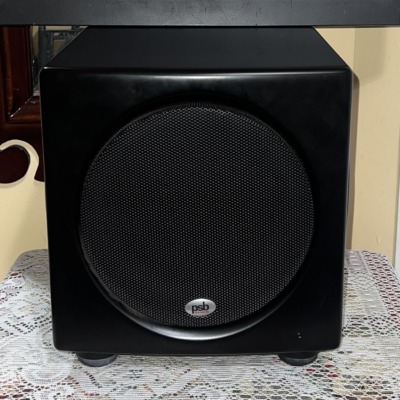 PSB SubSeries HD10 powered subwoofer front view, compact satin black cabinet with a black mesh grille over the front driver
