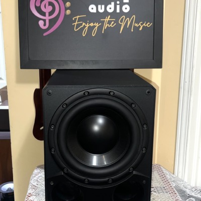 Paradigm DSP-3100 v.2 powered subwoofer, grille off, showing the large black woofer and the twin front ports