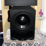 Paradigm DSP-3100 v.2 powered subwoofer, grille off, showing the large black woofer and the twin front ports