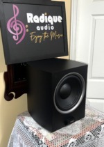 Paradigm PDR-10 v.4 subwoofer at an angle with grille off, showing the black cabinet's softened edges and forward-firing 10-inch driver