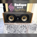 Paradigm Studio CC v2 centre channel with solid apple wood side panels — front view, grille off