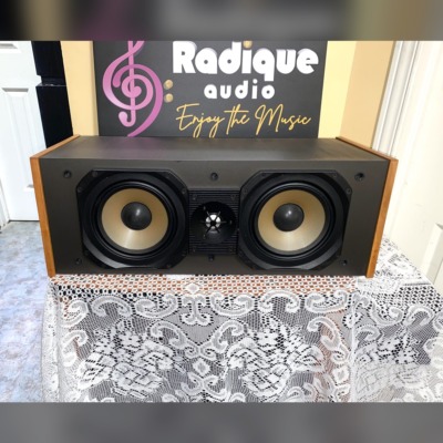 Paradigm Studio CC v2 centre channel with solid apple wood side panels — front view, grille off