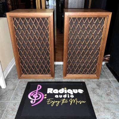 Pair of Pioneer CS-77 speakers in walnut cabinets with the classic diamond-lattice wood grilles, standing side by side