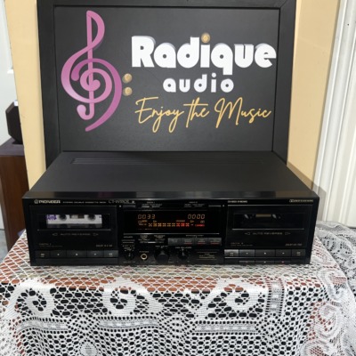 Pioneer CT-W550R double cassette deck, two auto-reverse wells either side of an orange fluorescent display and synchro copy keys