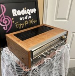 Pioneer SX-880 seen from above at an angle, black vented top grille set into the cherry wood cabinet, silver front panel along the edge