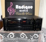 Pioneer VSX-9900S audio/video receiver straight on: black faceplate with wide fluorescent display, large master volume knob and Advanced Technology Receiver script