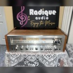 Pioneer SX-650 vintage stereo receiver in Ottawa Valley cherry cabinet — front view of silver faceplate