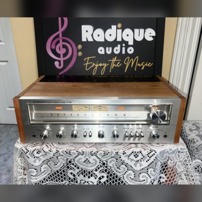 Pioneer SX-650 vintage stereo receiver in Ottawa Valley cherry cabinet — front view of silver faceplate