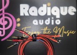 Close-up of the Radique House CCA cable ends: pin connectors on one end, small spade connectors on the other