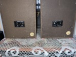 Close view of the Realistic Minimus-5 rear panels, black input plates marked Minimus-5, 8 ohms and Cat. No. 40-255A, with round gold stickers below