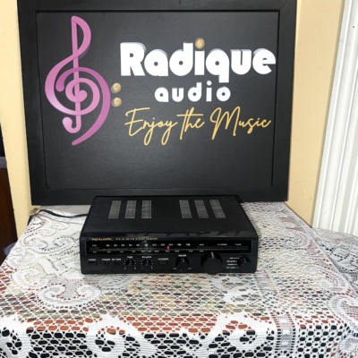 Realistic STA-20 AM/FM stereo receiver, compact black unit with a slide-rule FM/AM dial, tone, balance and volume knobs