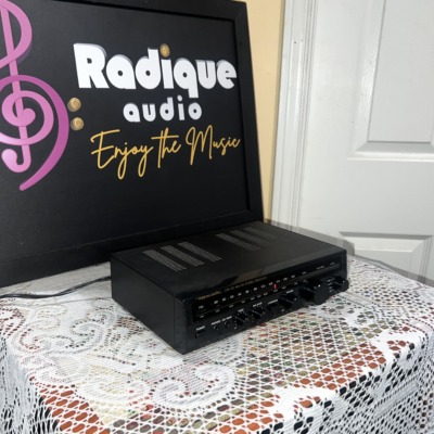 Realistic STA-20 receiver seen from the right, vented black top cover over the slim tuner dial and control row