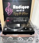Sansui P-50 automatic return belt-drive turntable straight on, black plinth with the clear dust cover closed