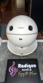 SoundSphere 2212-1 omnidirectional speaker, white sphere with the soundsphere name badge, two tweeters and a 22 decal, resting on a white dish