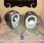 Silver Tannoy Arena satellites at an angle, showing the rounded cast aluminum cabinets and Dual Concentric drivers