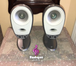 Silver Tannoy Arena satellites on their matching cast bases, grilles off, showing the Dual Concentric drivers